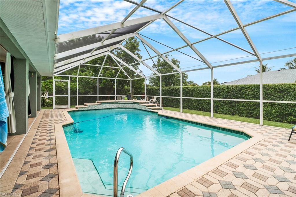 17532 Ingram Road Fort Myers, FL 33967 - Photo 30 of 46 a view of a swimming pool with a large window