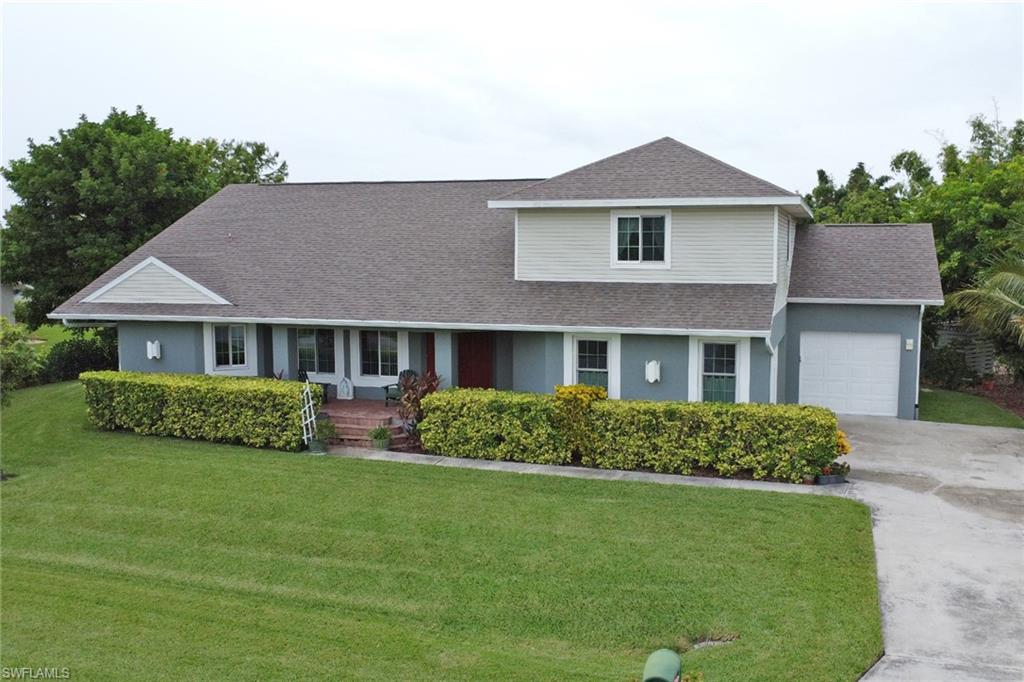 17532 Ingram Road Fort Myers, FL 33967 - Photo 38 of 46 a front view of a house with a garden