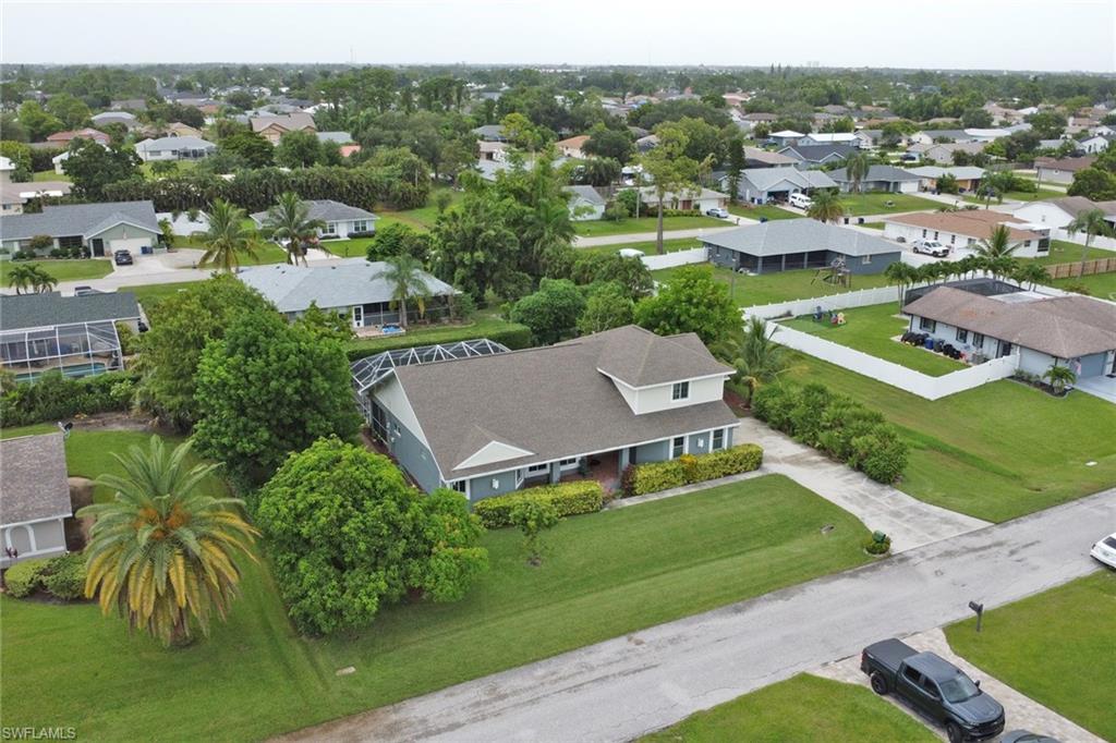 17532 Ingram Road Fort Myers, FL 33967 - Photo 41 of 46 an aerial view of residential houses with outdoor space and trees
