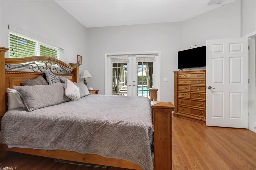 17532 Ingram Road Fort Myers, FL 33967 - Photo 7 of 46 a bed sitting in a bedroom next to a window
