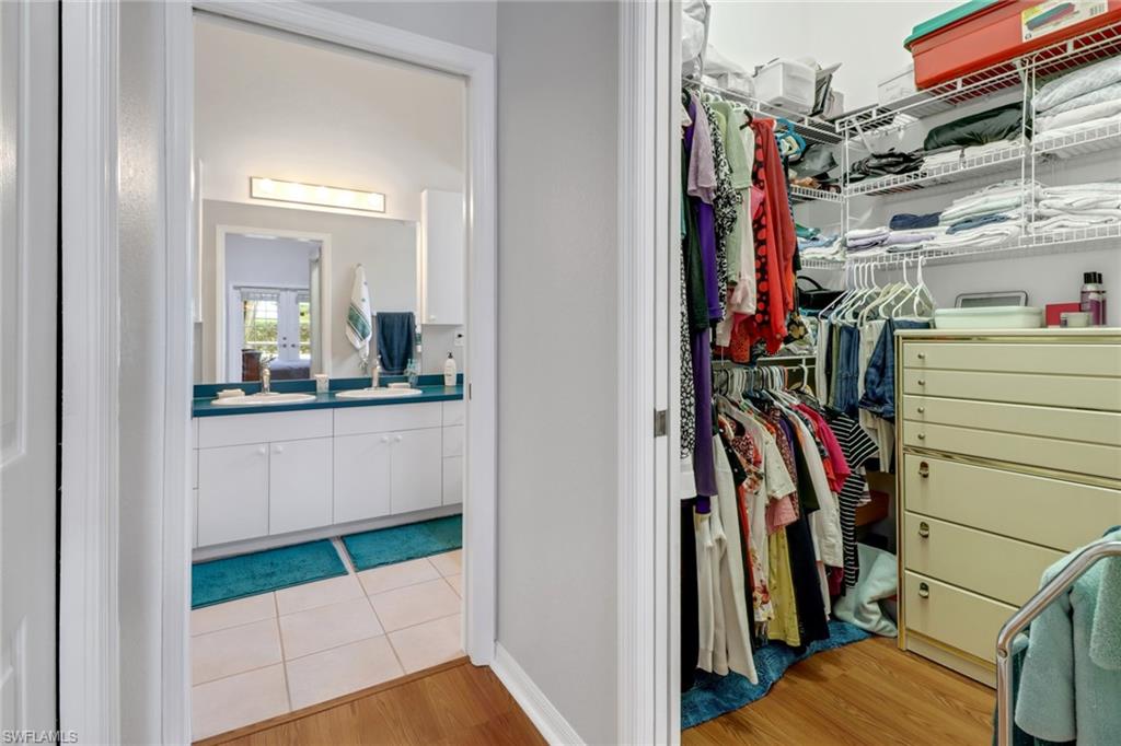 17532 Ingram Road Fort Myers, FL 33967 - Photo 9 of 46 a view of walk in closet with clothes and shoes