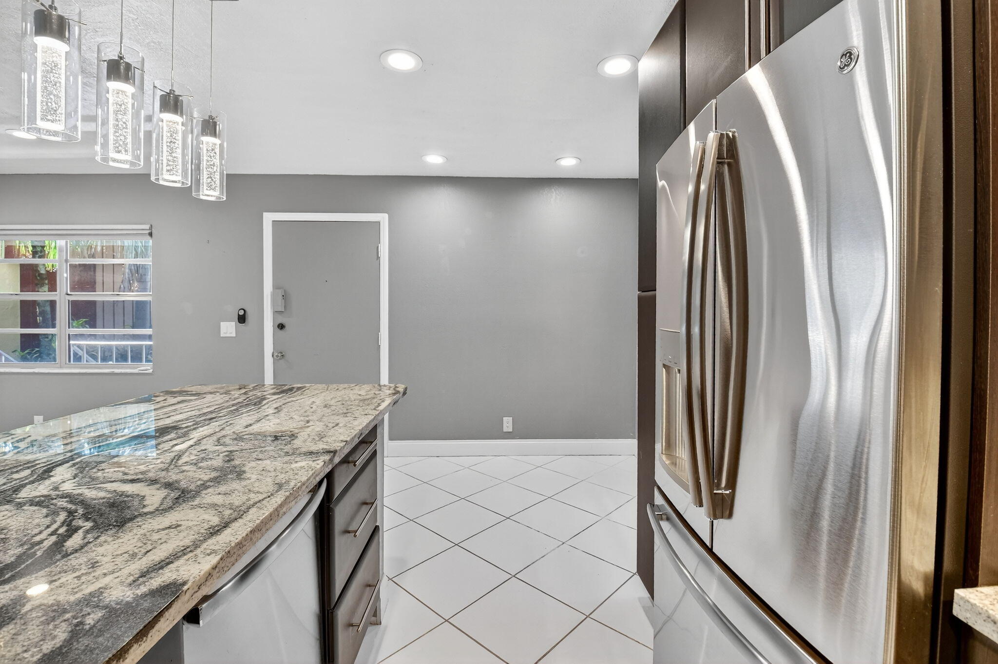 624 Flanders North Delray Beach, FL 33484 - Photo 11 of 44 a view of kitchen with stainless steel appliances granite countertop cabinets and a refrigerator