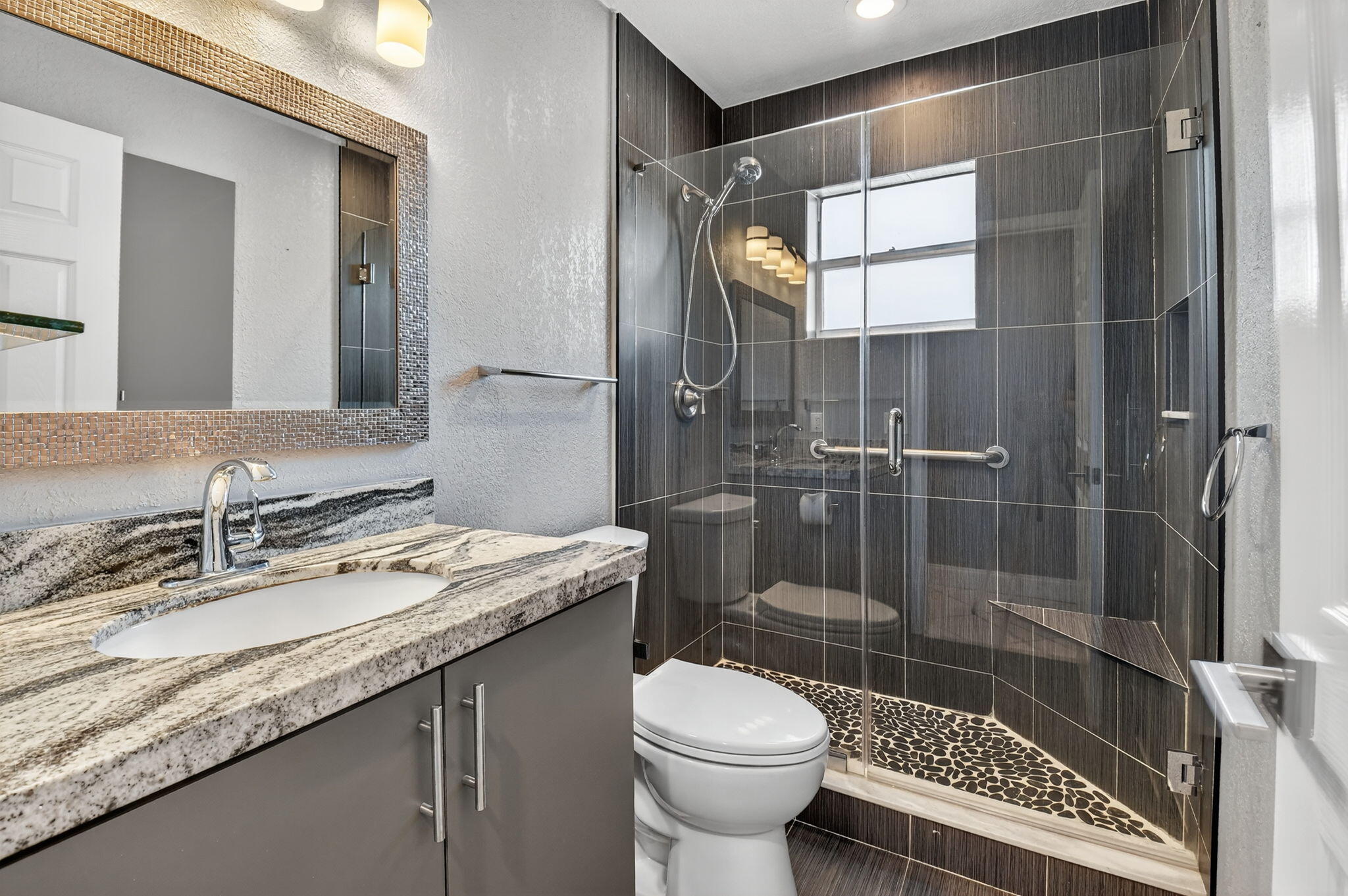 624 Flanders North Delray Beach, FL 33484 - Photo 13 of 44 a bathroom with a granite countertop sink toilet and shower