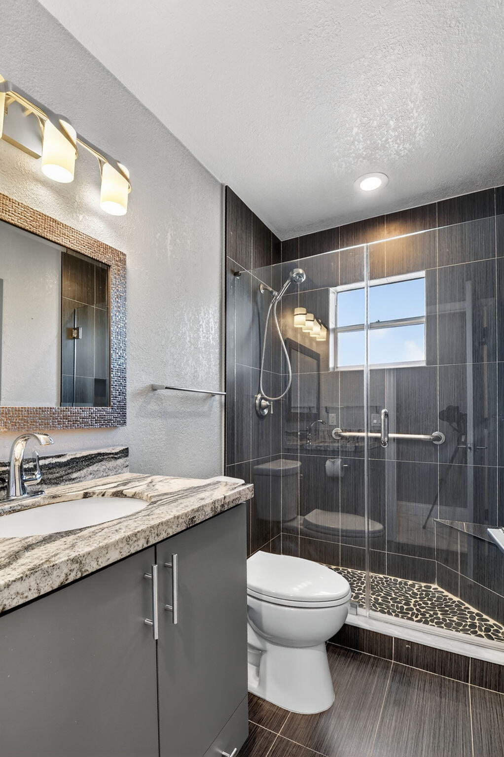 624 Flanders North Delray Beach, FL 33484 - Photo 14 of 44 a bathroom with a granite countertop sink toilet and shower