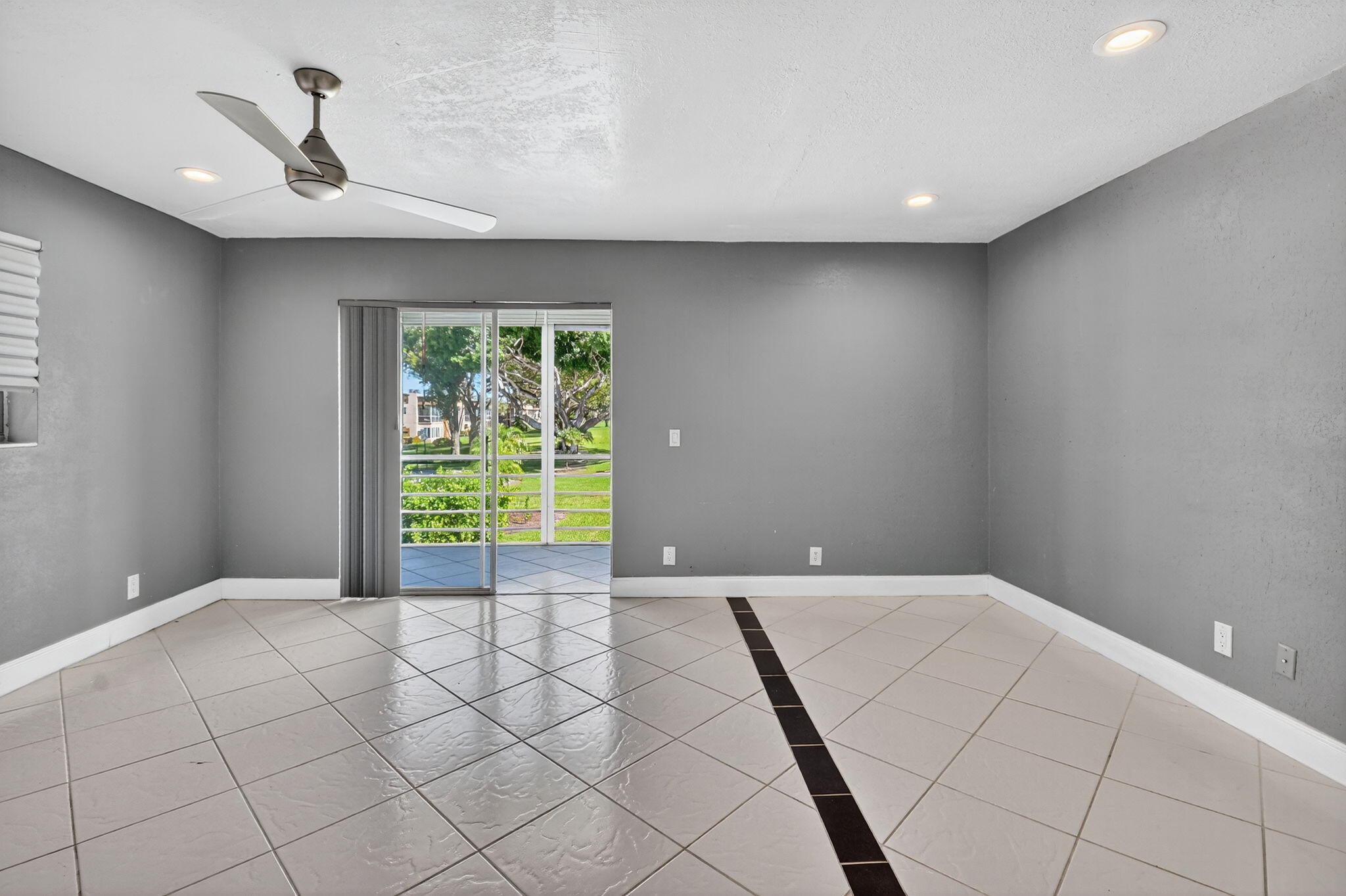 624 Flanders North Delray Beach, FL 33484 - Photo 15 of 44 a view of an empty room with a window