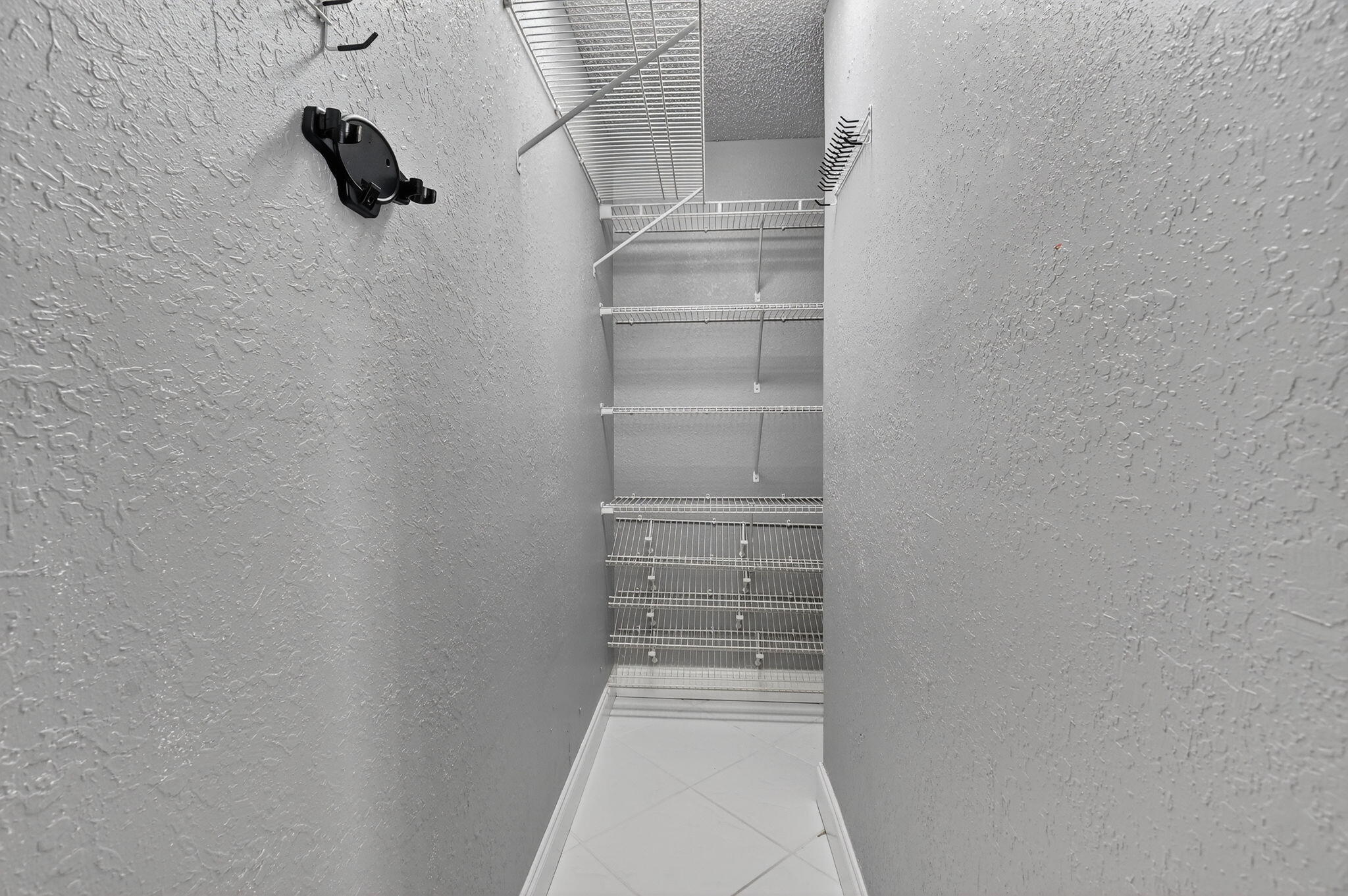 624 Flanders North Delray Beach, FL 33484 - Photo 20 of 44 a view of walk in closet with empty racks