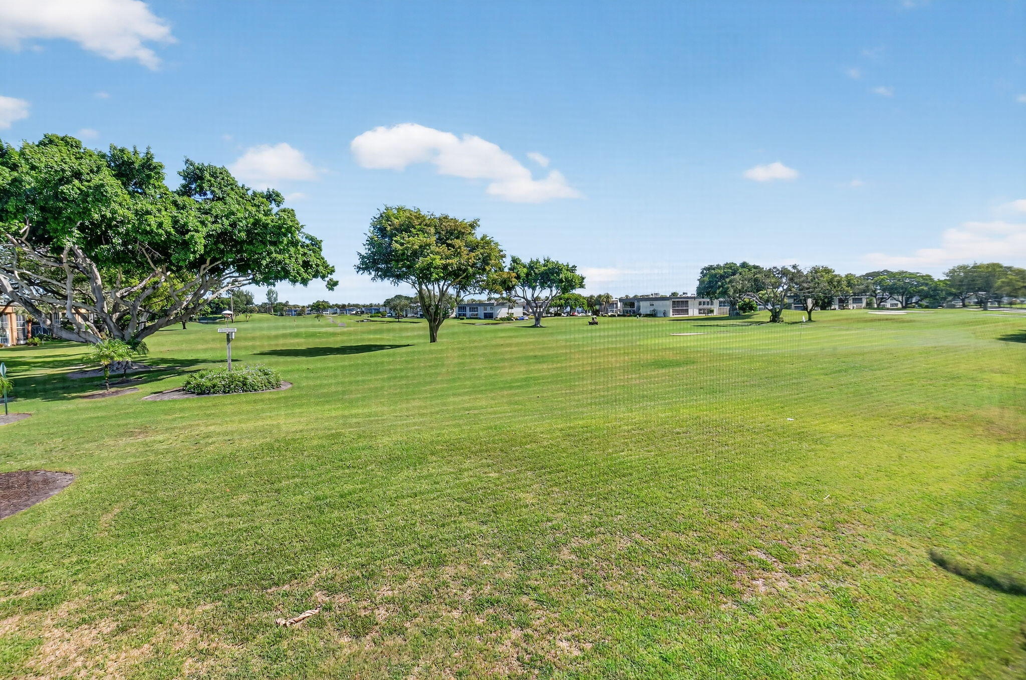 624 Flanders North Delray Beach, FL 33484 - Photo 28 of 44 a view of a lake with a big yard