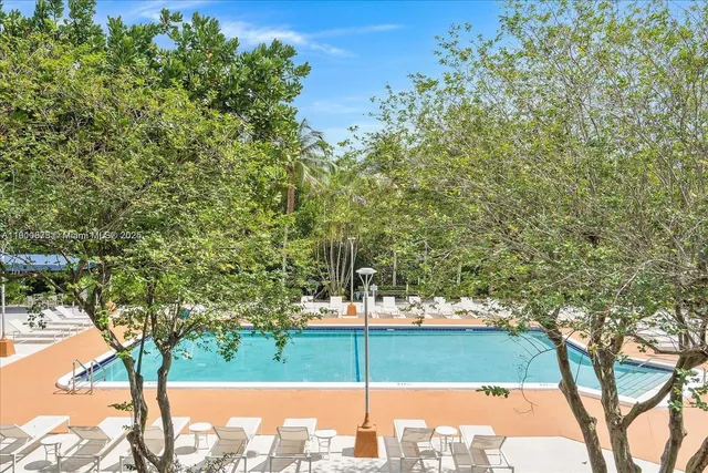 a view of a swimming pool with a patio