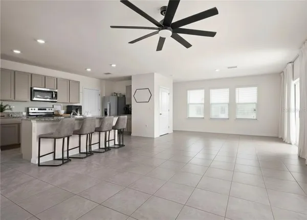 a view of dining room with furniture and a window