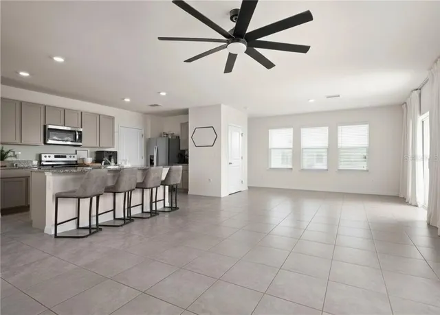 a view of dining room with furniture and a window