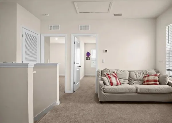 a living room with furniture and a couch