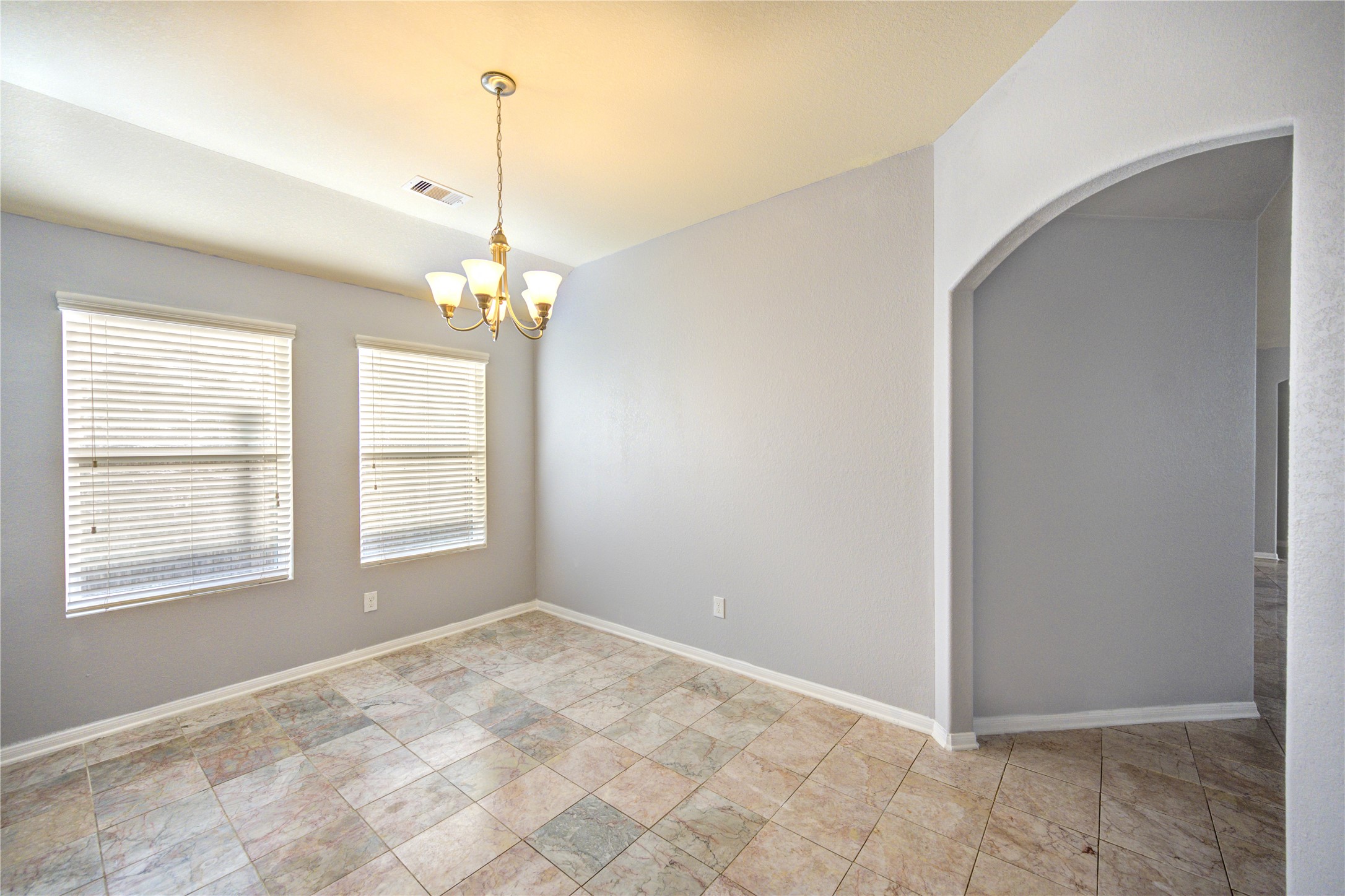 2102 Indian Clearing Trail Rosenberg, TX 77471 - Photo 12 of 29 a view of a room with windows and chandelier
