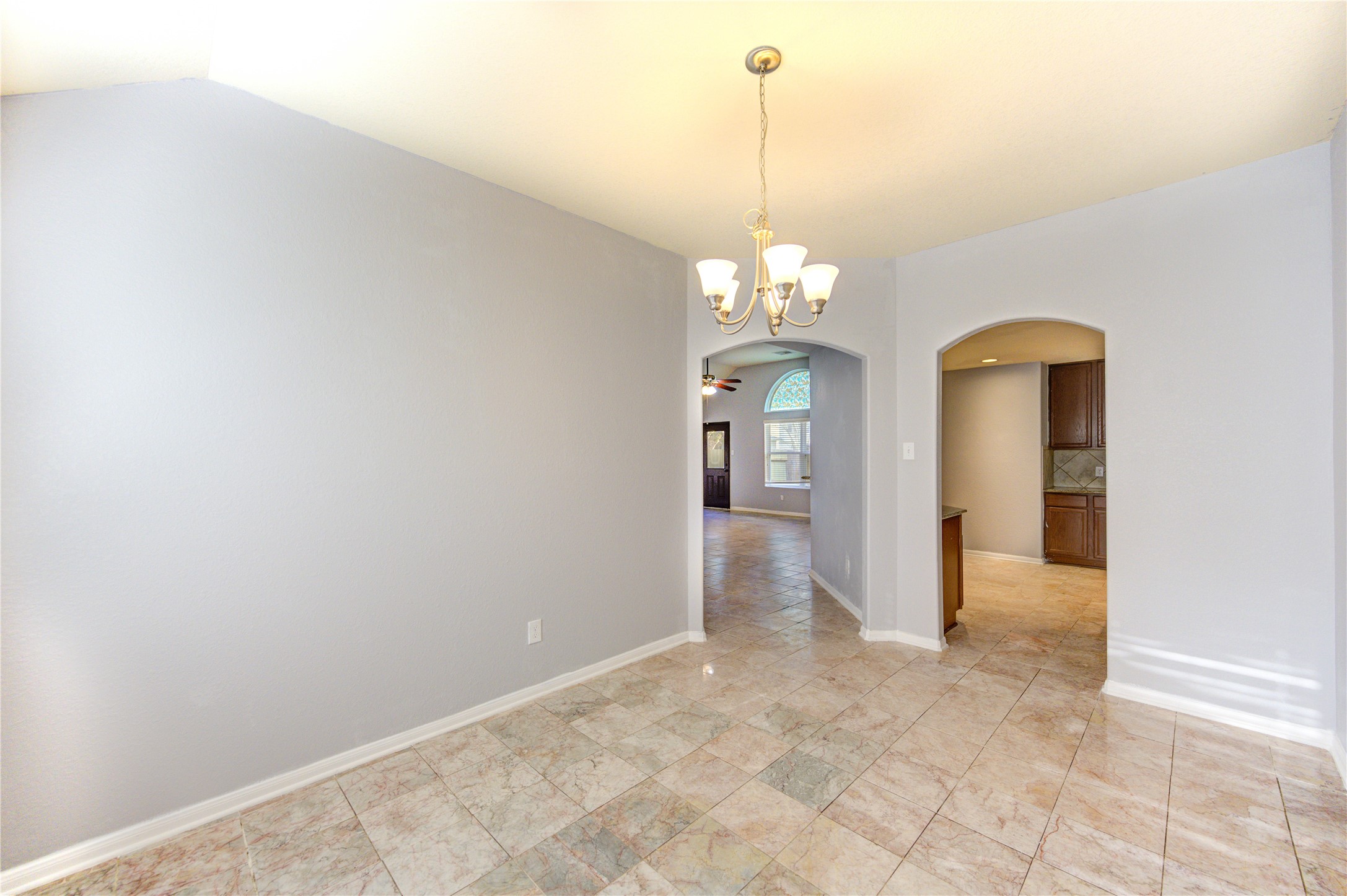 2102 Indian Clearing Trail Rosenberg, TX 77471 - Photo 13 of 29 a view of a hallway with a chandelier and chandelier