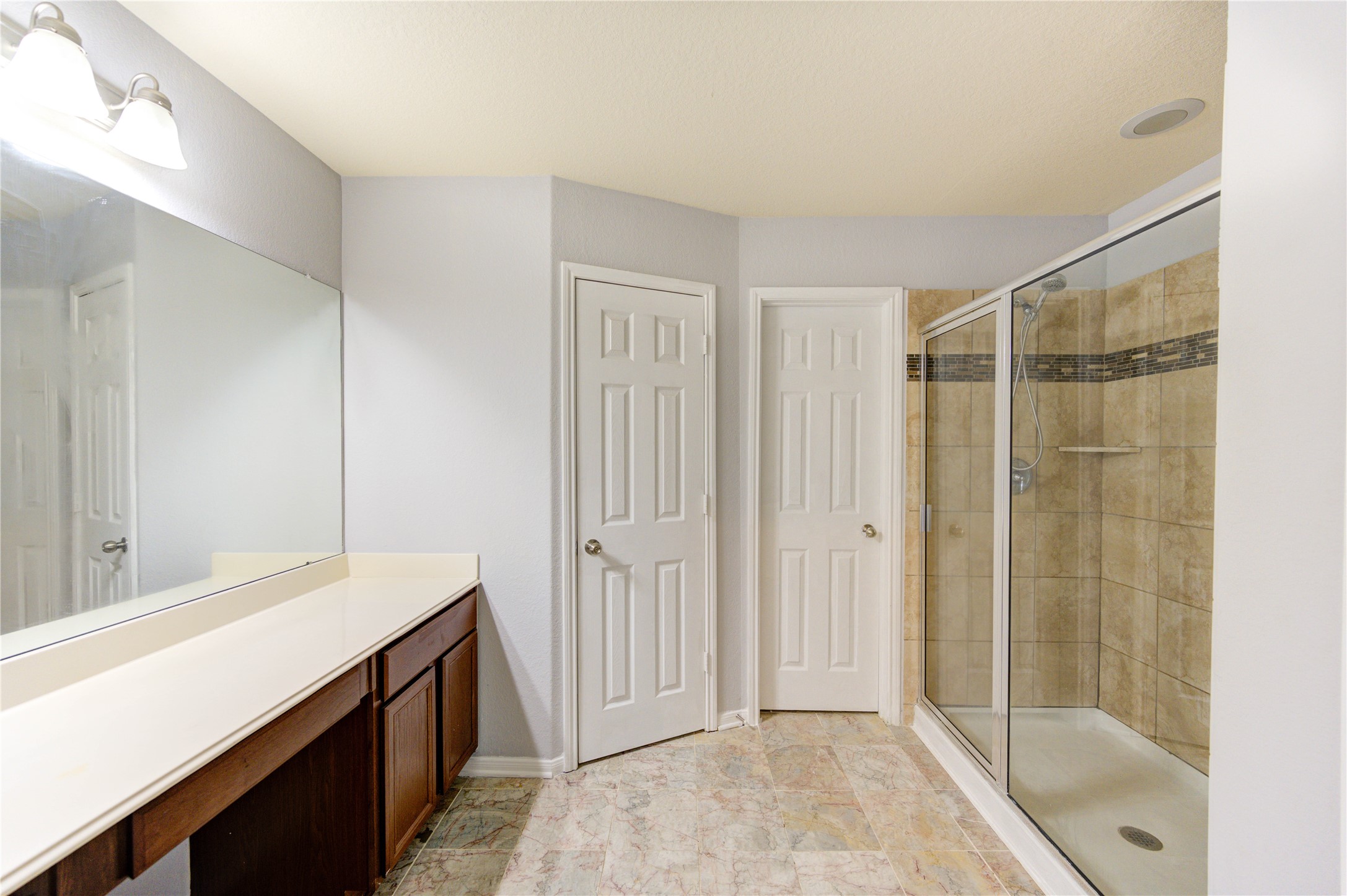 2102 Indian Clearing Trail Rosenberg, TX 77471 - Photo 20 of 29 a bathroom with a shower and a sink