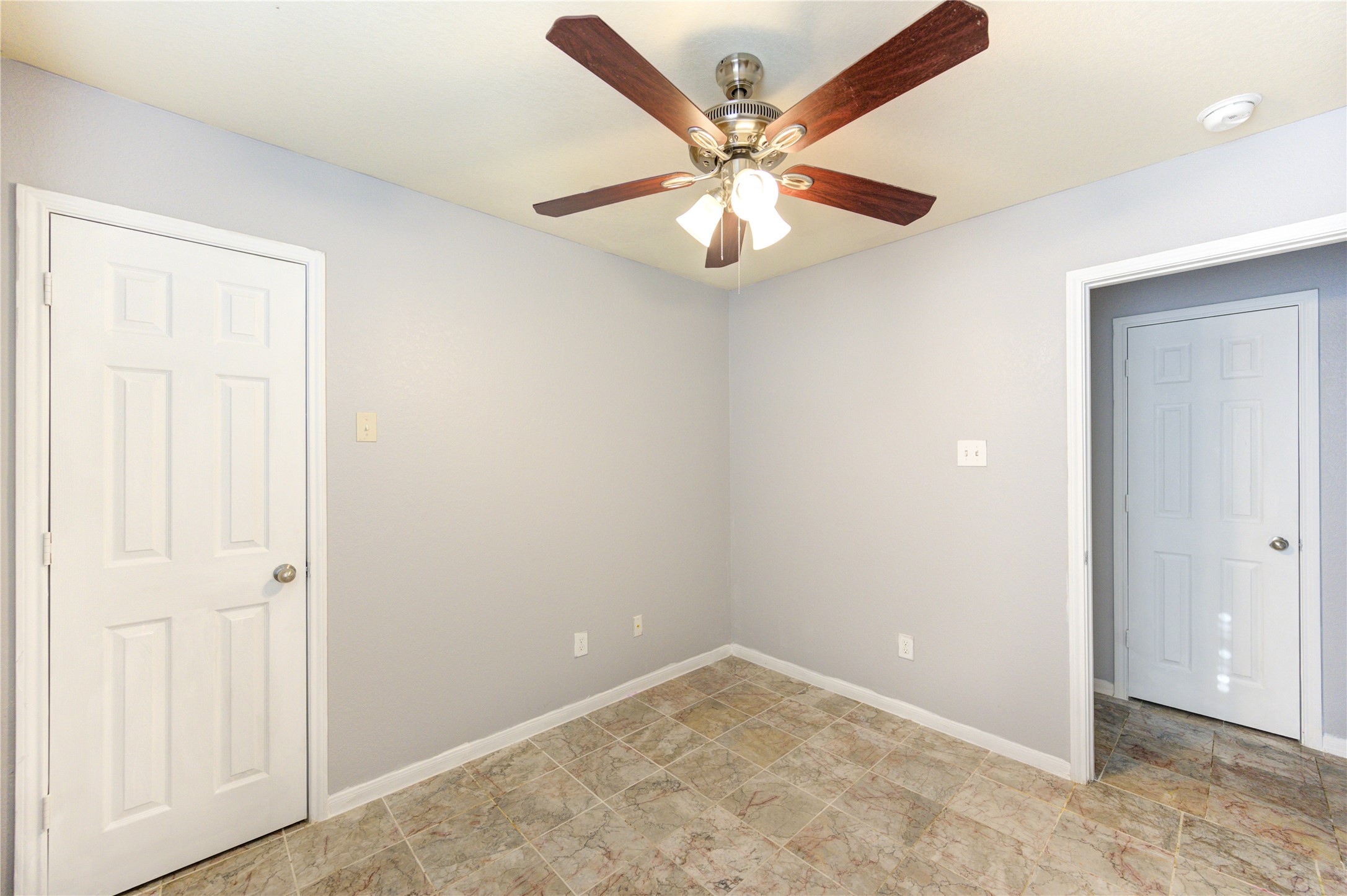 2102 Indian Clearing Trail Rosenberg, TX 77471 - Photo 26 of 29 an empty room with a chandelier fan and closet area