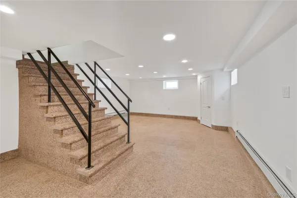 a view of an empty room with stairs