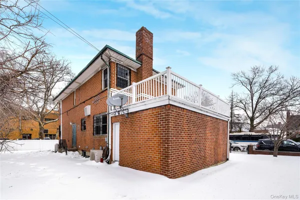 a view of a house with a snow in the yard