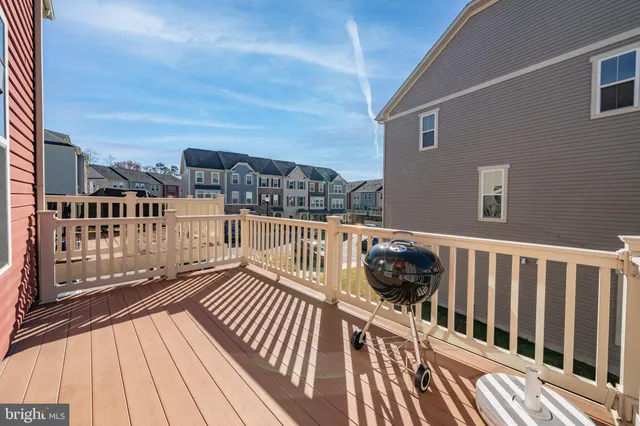 a view of a balcony with wooden floor