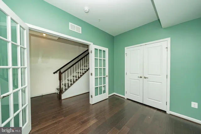 a view of an entryway with wooden floor