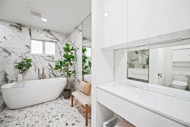 a living room with furniture and flowers