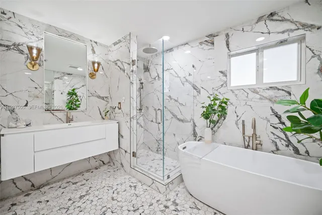a bathroom with a bathtub and shower