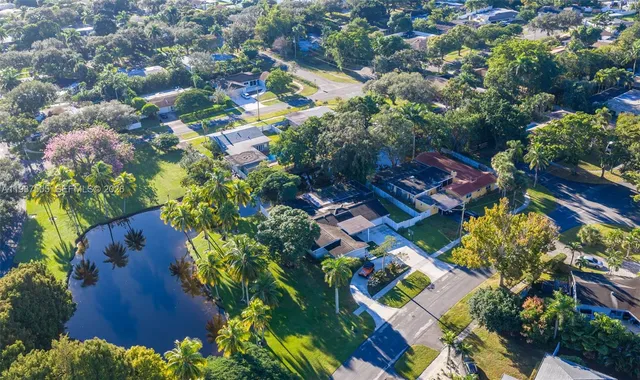 an aerial view of residential houses with outdoor space