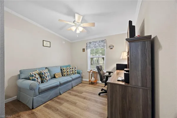 a living room with furniture and a window