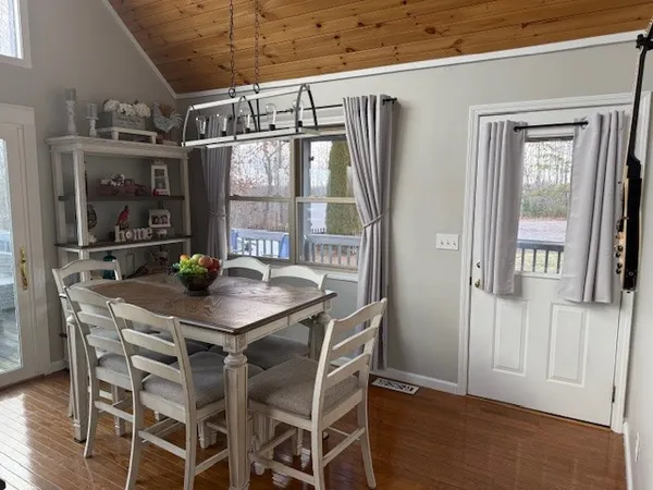 a view of a dining room with furniture window and wooden floor