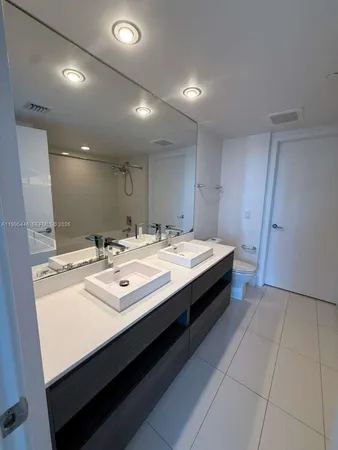 a spacious bathroom with a bathtub and a shower