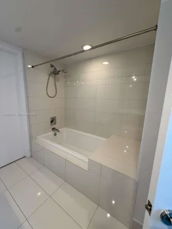 a view of an empty room and a window