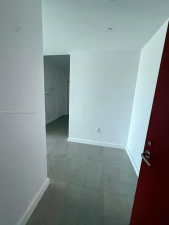 a kitchen with a stove and a refrigerator