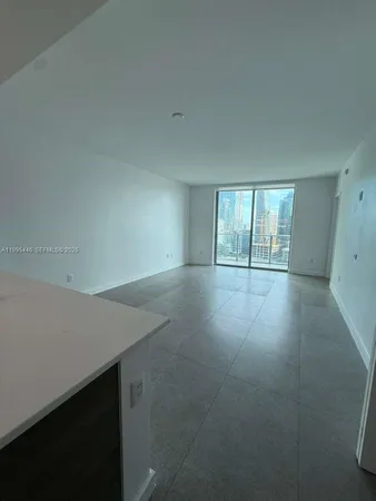 wooden floor and window in an empty room
