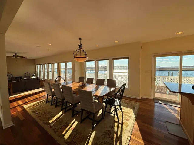a bed sitting in a spacious bedroom next to a window