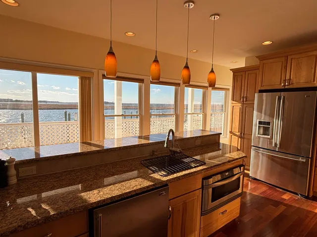 a bedroom with a large bed and a large window