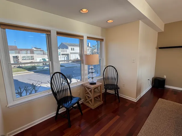 a view of a chairs and table in the balcony