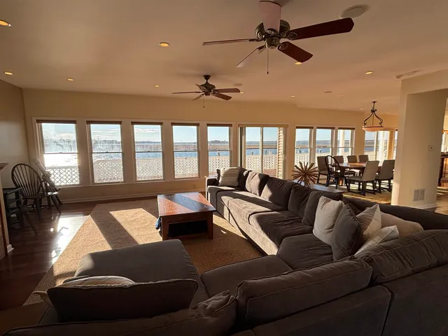 a view of a chairs and table in the balcony