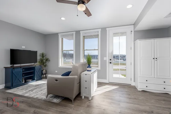 a living room with furniture and a flat screen tv