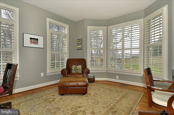 2801 Rifle Ridge Road Oakton, VA 22124 - Photo 11 of 30 a living room with furniture and a floor to ceiling window