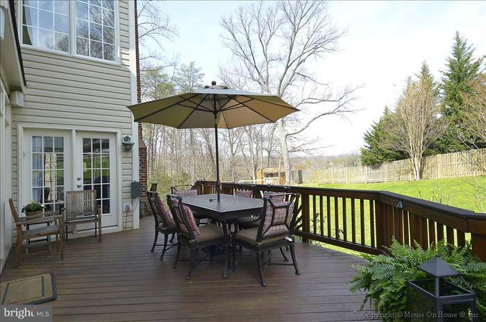 2801 Rifle Ridge Road Oakton, VA 22124 - Photo 13 of 30 a view of a chair and table on the deck