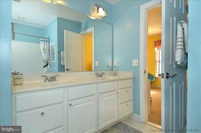 2801 Rifle Ridge Road Oakton, VA 22124 - Photo 26 of 30 a bathroom with a double vanity sink and a mirror