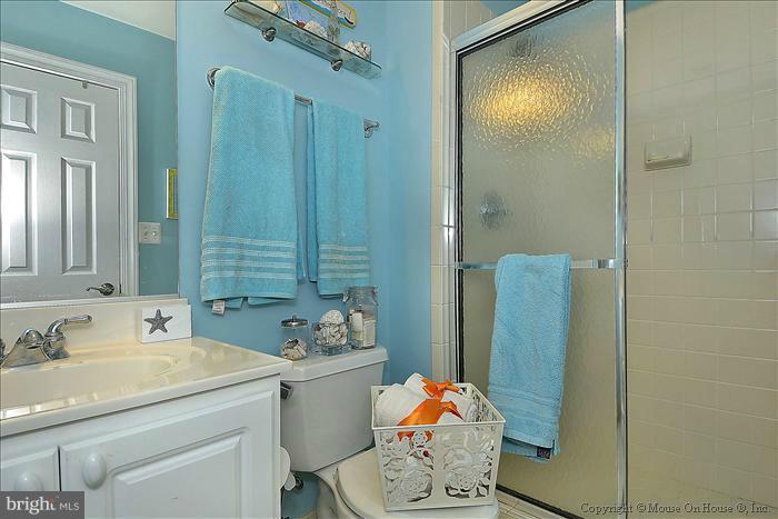 2801 Rifle Ridge Road Oakton, VA 22124 - Photo 4 of 30 a bathroom with a sink and mirror with shower