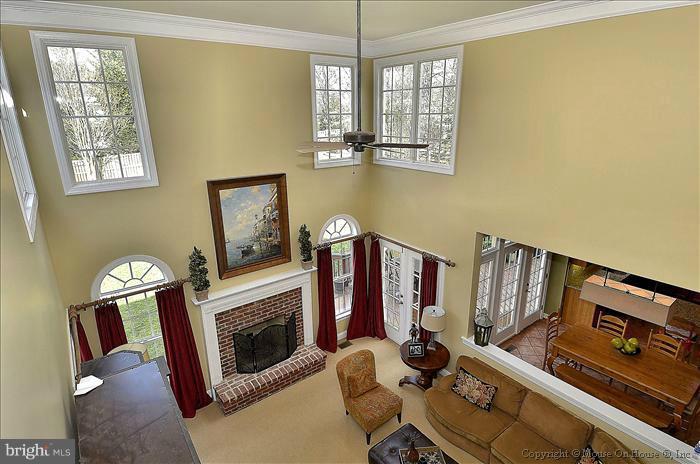 2801 Rifle Ridge Road Oakton, VA 22124 - Photo 10 of 30 a view of a livingroom with furniture and a fireplace
