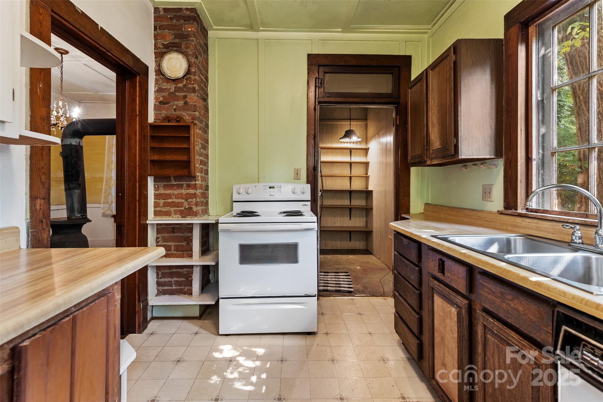 110 Vineyard Road Tryon, NC 28782 - Photo 13 of 20 a kitchen with a stove and a sink