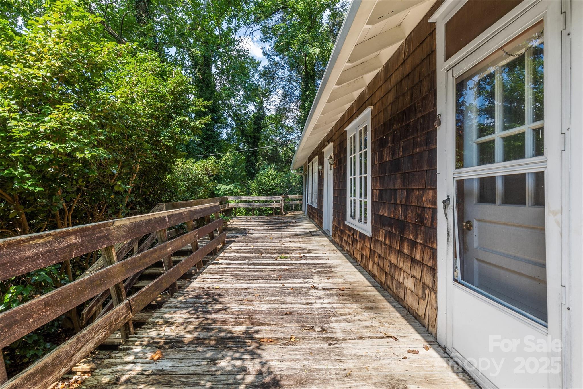 110 Vineyard Road Tryon, NC 28782 - Photo 19 of 20 a view of balcony with wooden floor and fence