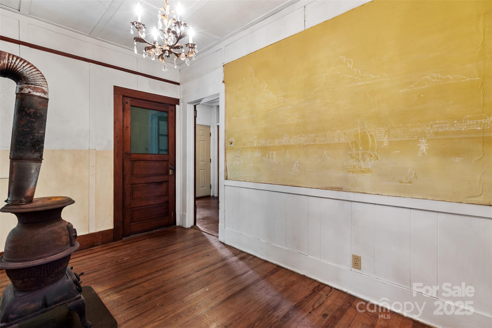 110 Vineyard Road Tryon, NC 28782 - Photo 10 of 20 a view of a room with wooden floor and chair in a room