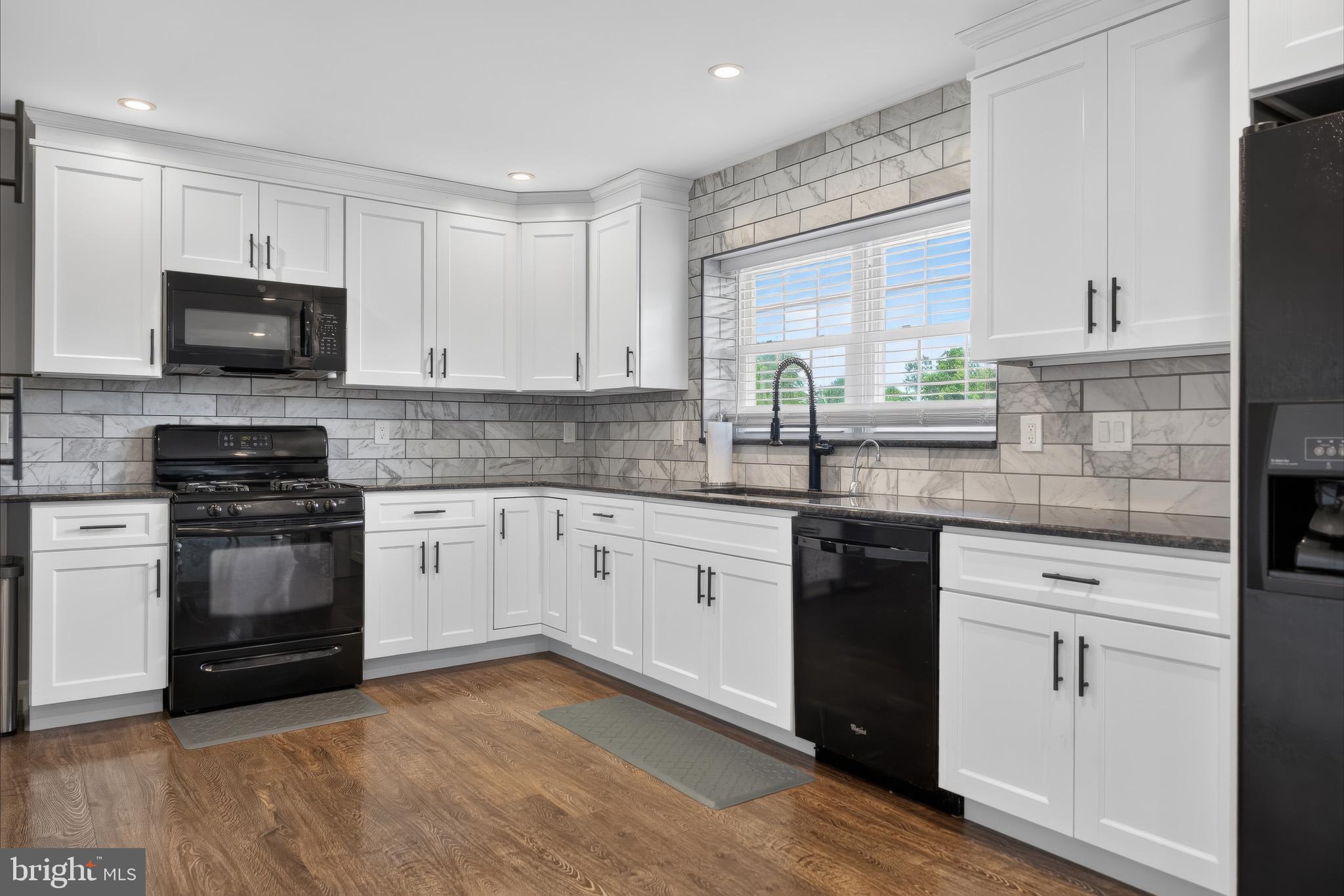 413 Broad Street Perkasie, PA 18944 - Photo 21 of 42 Modern kitchen with sleek finishes.