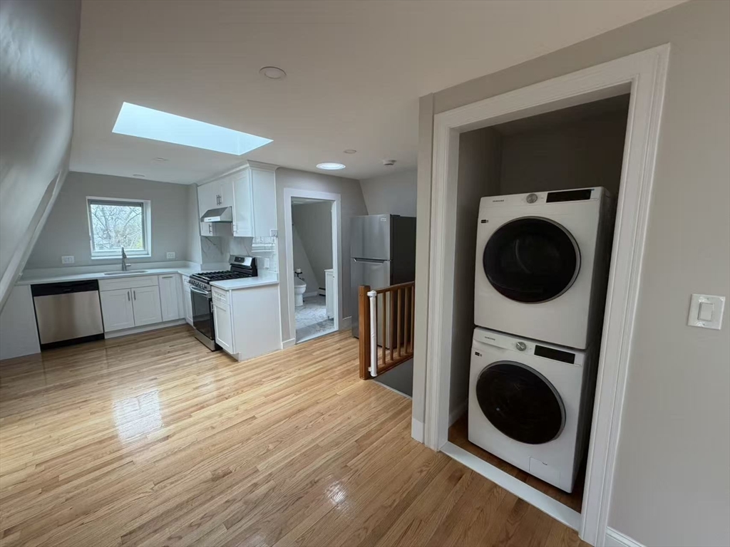 6 Channing Street, Unit 3 Newton, MA 02458 - Photo 3 of 12 a view of a kitchen with a washer and dryer