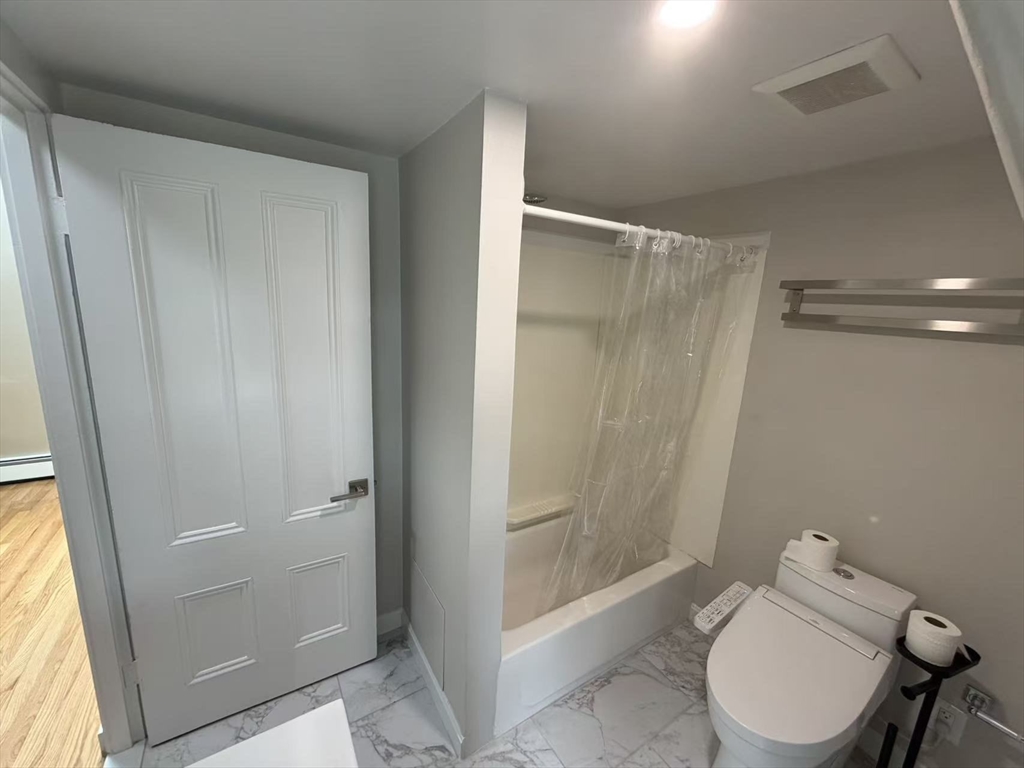 6 Channing Street, Unit 3 Newton, MA 02458 - Photo 4 of 12 a bathroom with a shower and toilet