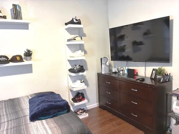 a living room with furniture and a flat screen tv