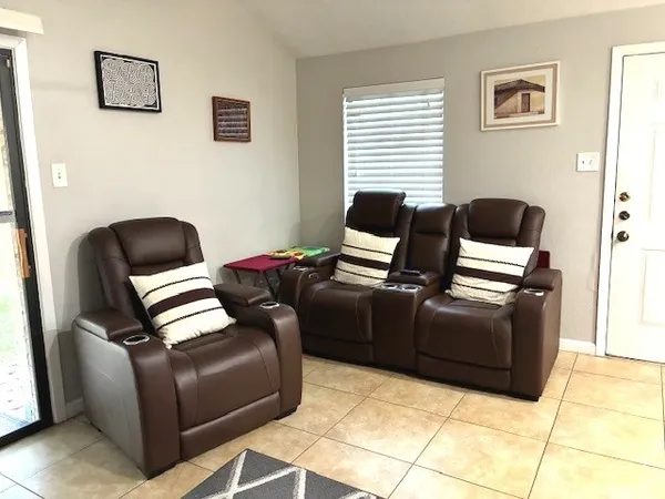 a living room with furniture and a window